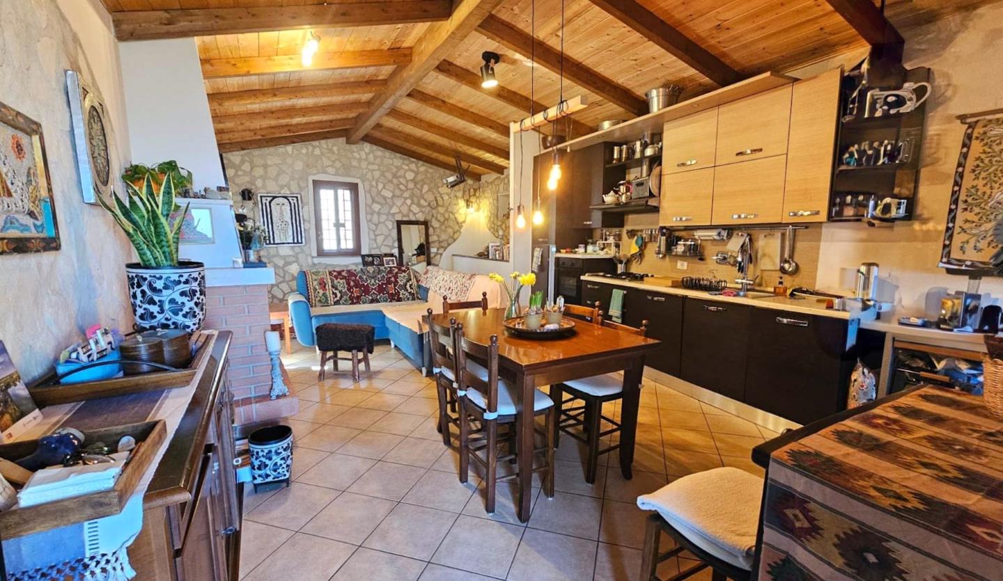 Soggiorno con angolo cottura